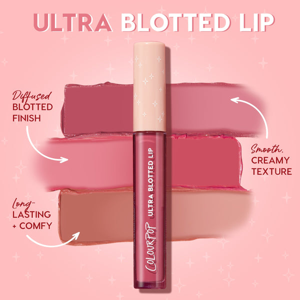 ColourPop Ultra Blotted Lip in Edgy Vibes stands upright with a cream cap and star accents, centered over three rosy mauve swatches that show a diffused blotted finish, smooth creamy texture, and long‑lasting comfy wear on a pink backdrop.