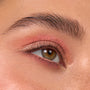 Hazel eye wearing peach matte and golden shimmer shadow with natural lashes, showcasing the Rainbow Rush ColourPop Shadow Palette Set in a crisp macro close-up, with inner-corner sparkle and softly blended crease.
