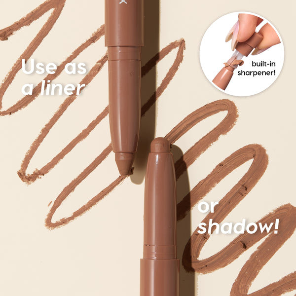 ColourPop Shadow Stix Cool Metallics drawing smooth brown metallic swirls, two twist-up shadow sticks uncapped with creamy tips and an inset showing the built-in sharpener, demonstrating use as eyeliner or eyeshadow on a beige backdrop.