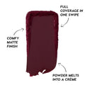 Deep berry swipe of Newborn Powder To Creme Lipstick from the Twilight collection, showing rich full-coverage color with a comfy matte finish and creamy texture against a clean white background.