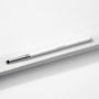 ColourPop Small Pencil Brush makeup brush lying diagonally on a white textured block, showing a slim white handle, silver ferrule, and small tapered bristles for precise eyeshadow application and smudging.
