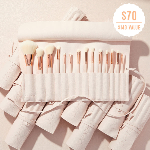 Major Eye Candy ColourPop Shadow Palette & Brush Set showcasing a blush‑pink brush roll opened to display a full lineup of soft white‑bristle face and eye brushes with rose‑gold ferrules, embossed ColourPop case, and a $70 ($140 value) badge on a pink backdrop.