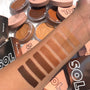 Forearm swatches display the Medium Dark ColourPop SOL Face & Body Bronzing Balm, a creamy face and body bronzer ranging from deep chocolate to warm tan, shown next to open SOL compacts with blush-pink lids to showcase pigment and blendability.