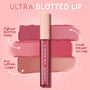 ColourPop Ultra Blotted Lip Zuma stands upright, displaying mauve and nude swatches that show a diffused blotted finish and smooth, creamy texture, highlighting a long-lasting, comfy formula against a pink, starry backdrop.