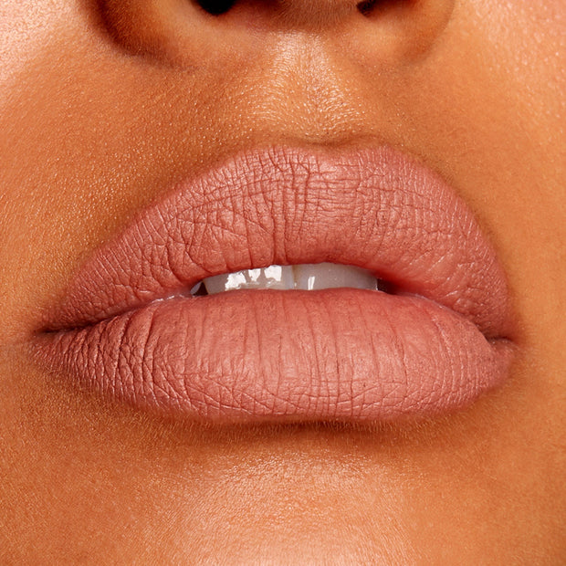 Full lips lined and filled with BFF Lippie Pencil by ColourPop in a nude-rose matte, showcasing precise definition and smooth payoff; studio close-up highlighting the long-wearing ColourPop Lippie Pencil finish.