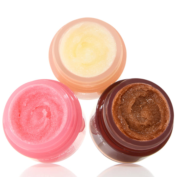 Neapolitan Sundae lip scrub trio displaying swirled sugar textures in open jars - strawberry pink, vanilla cream, and chocolate brown - arranged in a triangle on a white background; ColourPop Lip Scrub bundle.