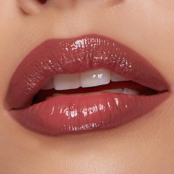 Glossy, plumped pink‑mauve lips softly parted, lined and filled with Glazed Pout from the ColourPop So Juicy Plumping Lip Liner & Balm Set, shown in a studio close‑up to highlight high‑shine finish, smooth texture, and precise definition.