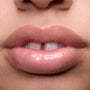 Close-up swatches of Colourpop Peach Mochi Fresh Kiss Glossy Balm on models’ lips, showing sheer peachy shimmer and high-shine finish, highlighting how this Lip Gloss & Lip Oil hybrid looks on different skin tones.
