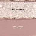 Two Heart to Get For Your Eyes Only Shadow Stix swatches laid side by side, showing a shimmery champagne shade labeled NOT AVAILABLE above a matte mauve shade labeled TRY HARDER on a clean studio background.