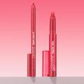 ColourPop Lippie Stix + Pencil Set in Va Va Voom shown uncapped, lippie pencil and matching Lippie Stix standing upright with translucent cherry-pink tubes and white logos, on a light surface against a pink gradient background.