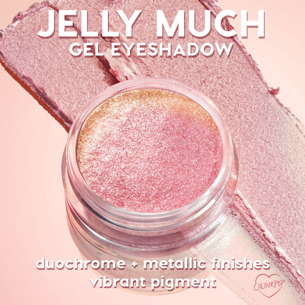 ColourPop Jelly Much Shadow Boo-Kay sparkles in an open glass jar, a pink-to-gold duochrome gel eyeshadow with metallic shimmer, shown swatched in smooth wide strokes on a soft pink background.