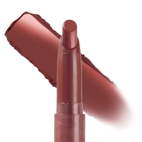 Kapish ColourPop Lippie Stix shown uncapped, angled bullet poised to apply with a wide rosy-brown swatch behind it on a white backdrop, highlighting the high-pigment lip color crayon in the Kapish shade.