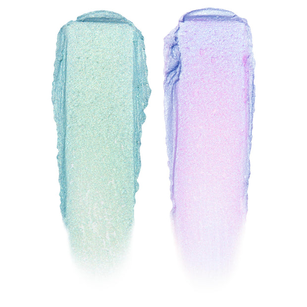 Two swatches display ColourPop Shadow Stix, Cute and Feisty - left a shimmering mint green, right an iridescent lavender with pink shift - swiped in thick vertical strokes on a white background.