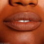 Lips lined and filled with ColourPop Lippie Pencil in BFF 3, showcasing a warm brown matte finish; close-up swatch for The Lil Box of Lippie Pencils under studio lighting, highlighting smooth texture and precise outline.
