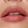 Close-up of softly parted rosy nude lips wearing Dream Duo, a ColourPop Ultra Lip Duo, precisely lined and filled in shade Five Stars with a smooth satin sheen against natural skin.