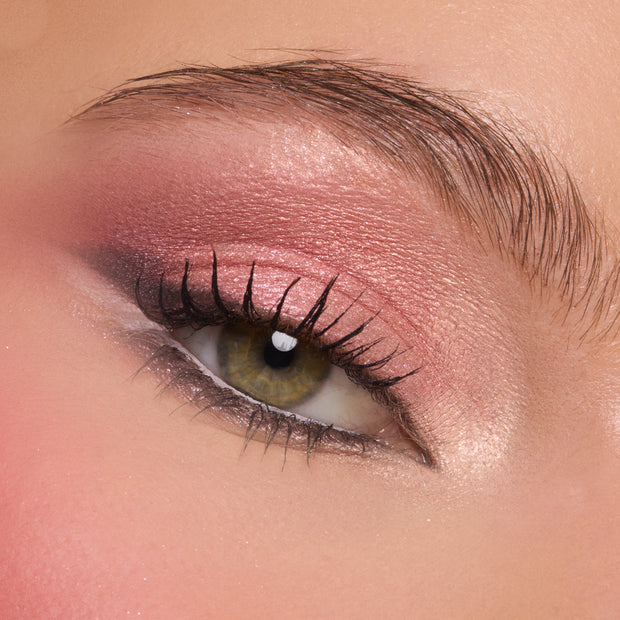 Shimmering rose smoky eye showcases the Smoke 'N Roses ColourPop Shadow Palette, featuring metallic pink lid, mauve crease, soft charcoal outer corner, bright inner-corner highlight, and defined lashes in a tight beauty close-up.