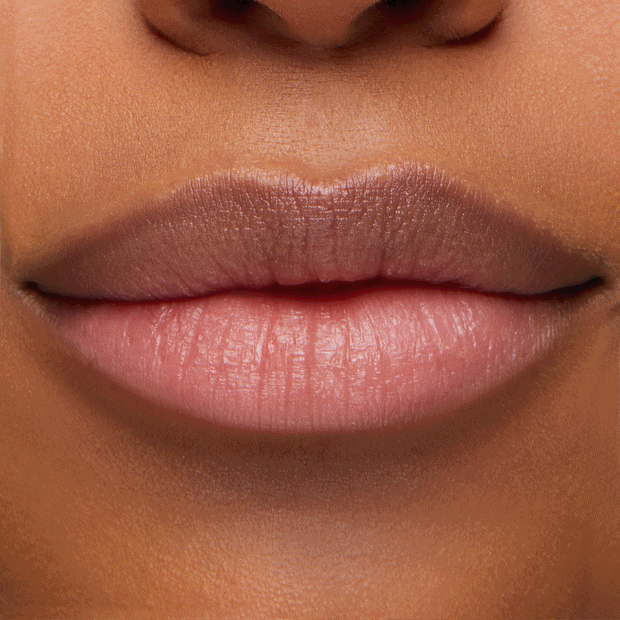 Close-up lips changing from natural to a soft pink after applying Transform pH Lip Balm, showing the color-adapting, glossy finish of ColourPop pH Lip Balm in studio lighting.