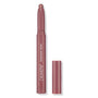 ColourPop Shadow Stix in Next Spot stands uncapped with the rounded shimmer tip exposed, showing a rosy mauve metallic shade; slim pencil with ColourPop Shadow Stix branding, cap beside it on a clean white background.