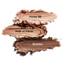 ColourPop Shadow Stix Shimmering Golds swatches display three creamy metallic strokes on a white background - Honey BB (champagne), Walk of Fame (warm gold), and Quokka (deep bronze) - smeared to showcase shimmer and blendable payoff.