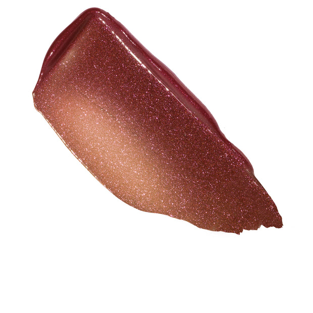 Shimmery gloss balm swatch fans out in a thick swipe, showcasing the L-O-V-E shade’s rose-gold to berry pink gradient with fine sparkle on a white background, highlighting the ColourPop So Juicy Plumping Gloss Balm with Peptides texture.