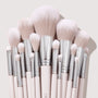 Metallic Mood brushes fan out in a tight cluster, showcasing soft blush-pink bristles, chrome ferrules, and pale pink handles on a light backdrop - part of the ColourPop Shadow Palette & Brush Set for precise eye and face makeup.