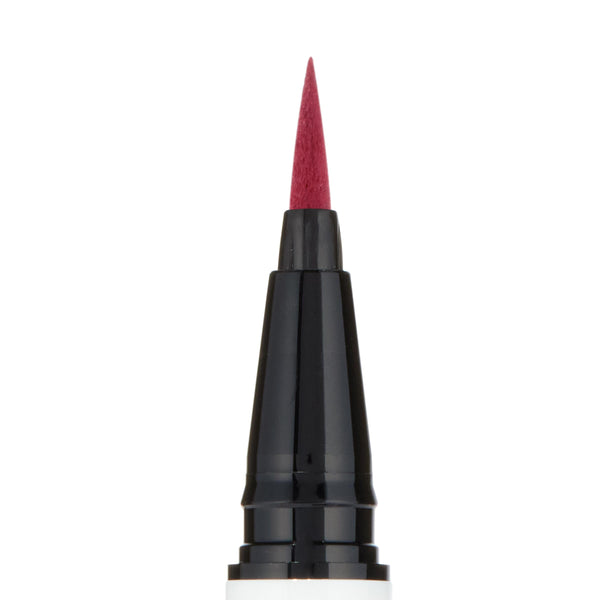 Felt-tip applicator poised to draw crisp lines, macro close-up of the Try Me shade (deep berry red) from the ColourPop BFF Liquid Liner, centered on a black-and-white pen barrel against a white background.