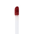 Doe-foot applicator coated in Tulum, a warm terracotta red from ColourPop Ultra Matte Lip, showing velvety texture on a white wand in a crisp macro close-up against a plain white background.