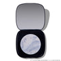 Open compact of Change Me Mega Highlighter with shimmering icy lavender and silver marbled pan set in a sleek black case with mirror, styled on a white background for the Twilight makeup collection.