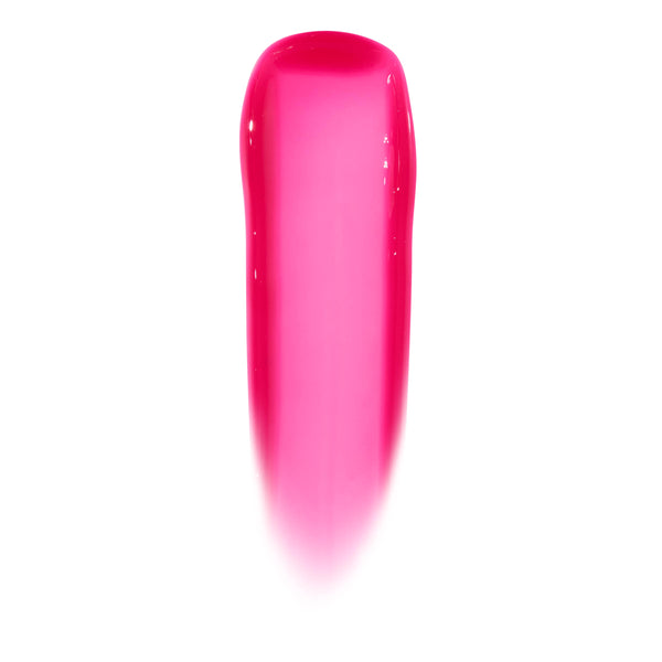 Glossy lip swatch shows the sheer hot pink, high-shine jelly finish of the ColourPop Ultra Glossy Lip in Surfer Vibes, displayed as a smooth vertical swipe on a white background.