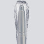ColourPop Shadow Stix in Witch, Please showcases a creamy icy-silver shimmer, the crayon tip extended with a bold swatch behind to highlight pigment and sparkle, centered in a sleek silver tube on a light gray background.