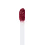 Doe-foot applicator coated in You Win Ultra Matte Lip, a deep berry red, showing velvety pigment and texture in macro on a white background; ColourPop Ultra Matte Lip wand ready for precise, long-wear application.
