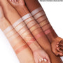Cold One ColourPop Pressed Powder Highlighter swatched across three forearms, showcasing an icy silver glow with high-shine shimmer, built from sheer to opaque to compare payoff on light, medium, and deep skin tones under studio lighting.
