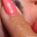 ColourPop Jelly Much Shadow in Emo Inside spreads in a deep violet, sparkly gel swatch across skin as a fingertip with coral glitter nails applies it in a close-up beauty demo.