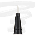 ColourPop BFF Liquid Liner Graceland creating bold white strokes with a fine felt tip; close-up of the black pen barrel and pointed brush, white eyeliner swatches behind, for precise wings and graphic eye looks.